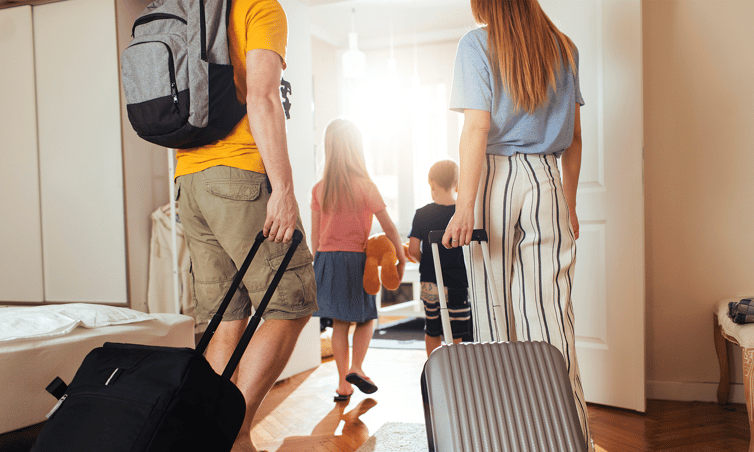 Family Leaving Suitcases
