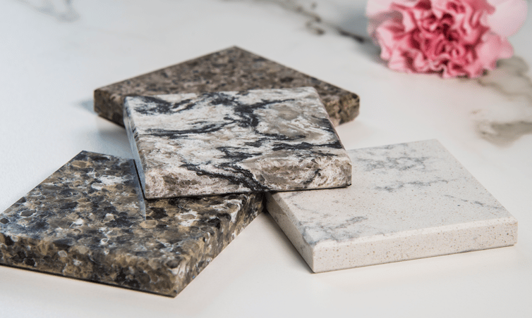 Square samples of granite countertop material
