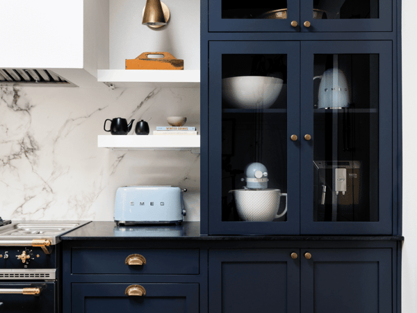 Blue Cabinets and Granite Countertops Make a Grander Kitchen