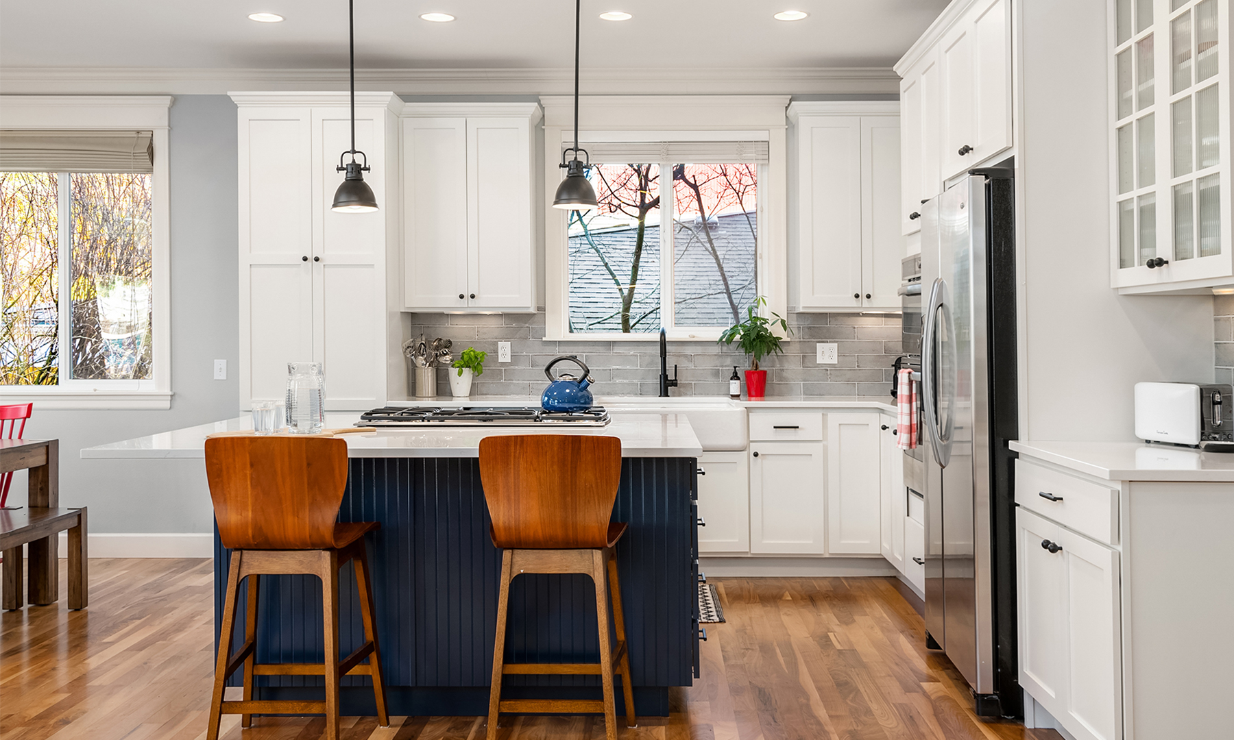 Transitional kitchen with white cabinets in Maple Leaf, Seattle